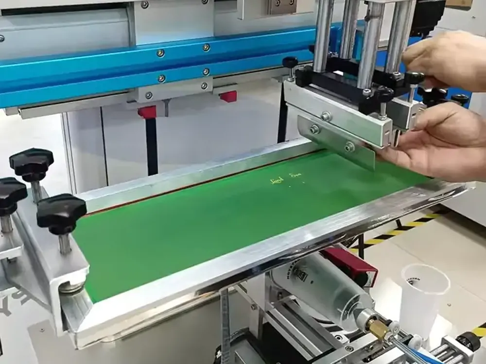 A semi-automatic cylindrical screen printing machine designed for cups, illustrating the process of semi-professional screen printing on styrofoam cups.